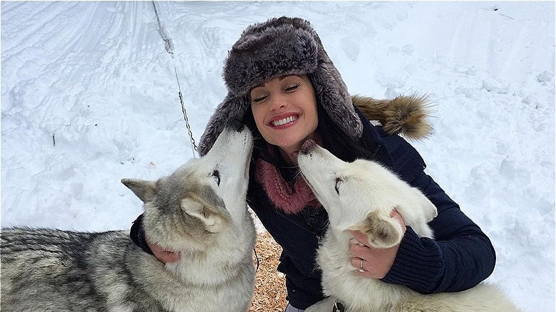 Emily Compagno laughing with dogs