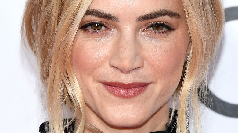 Emily Wickersham smirks