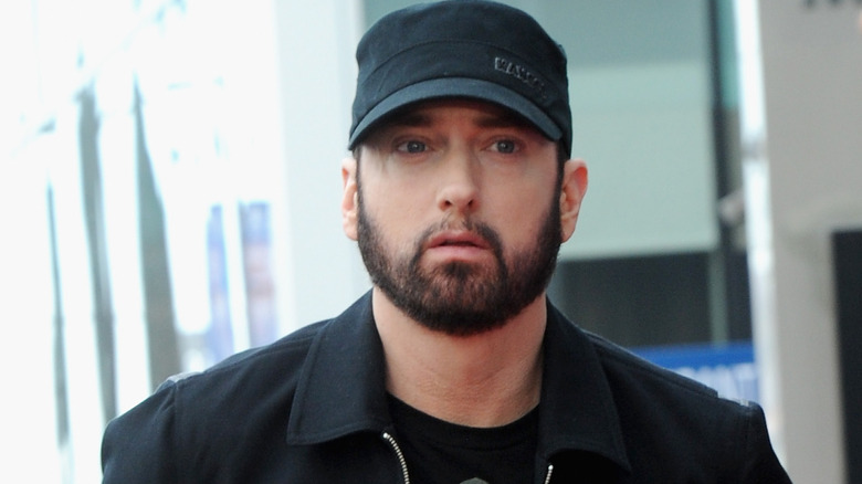 Eminem head in hands tattoos