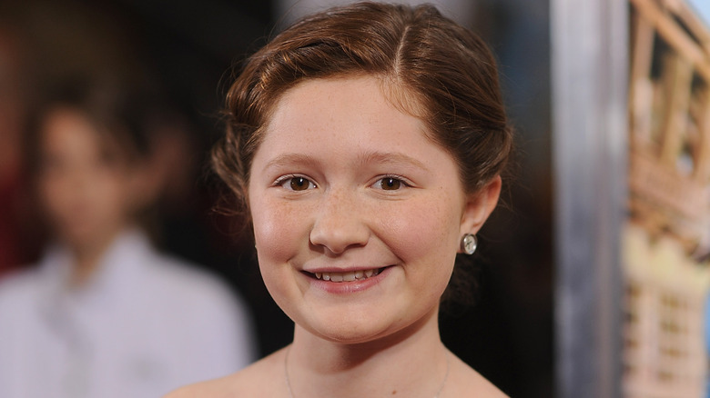 Young Emma Kenney wearing hair pulled up