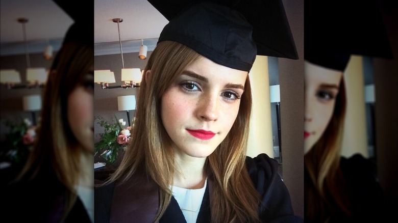 Emma Watson smiles for a picture in her graduation cap