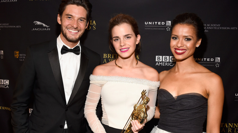 Emma Watson smiles for a photo with her BAFTA trophy