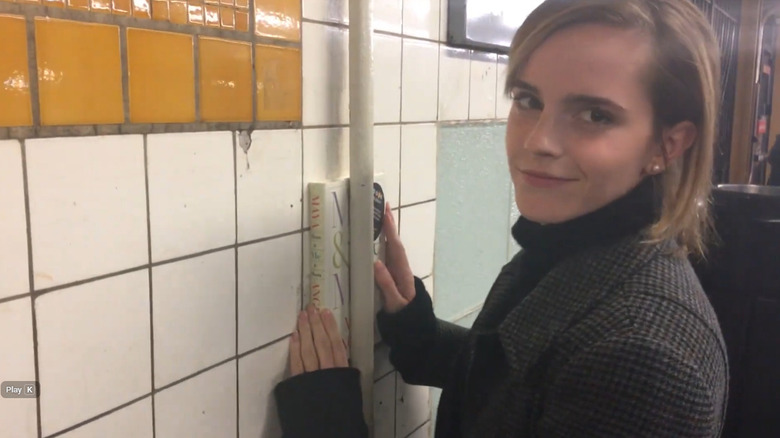 Emma Watson hiding a Maya Angelou book