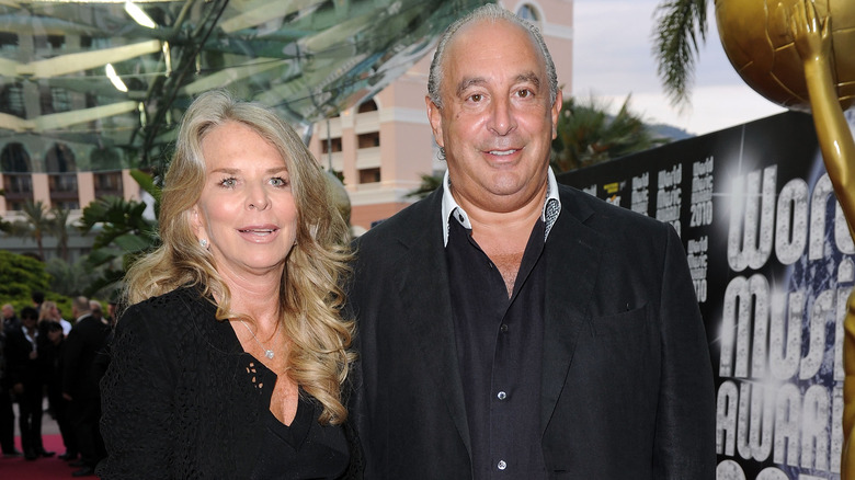 Sir Philip Green poses with his wife 