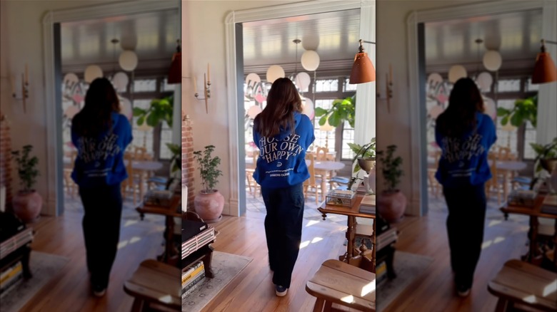 Emmie Gaines with her back to the camera