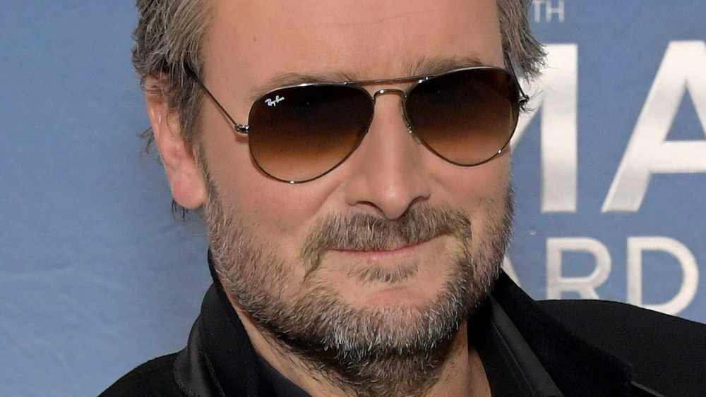 Eric Church smiling wearing sunglasses