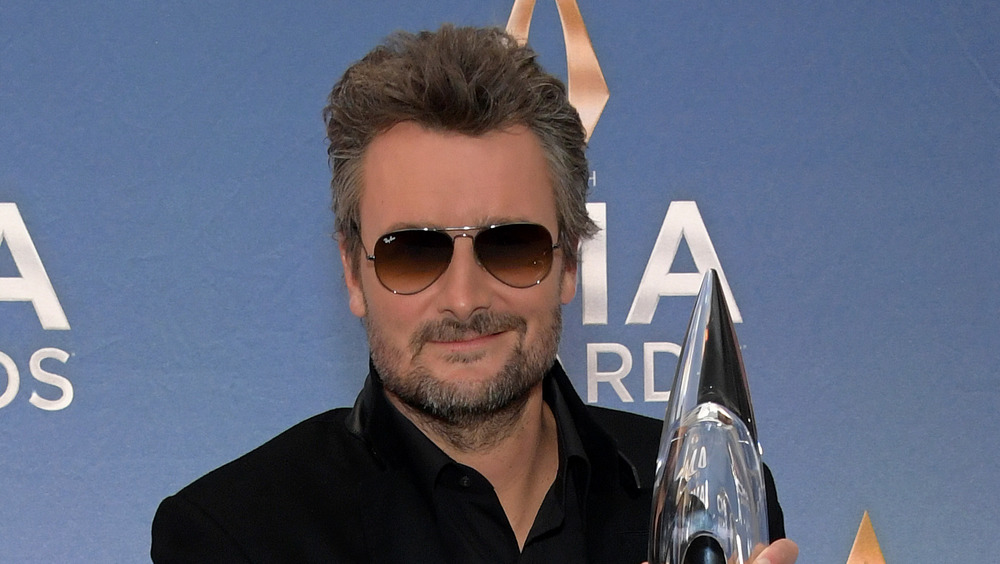 Eric Church posing with award