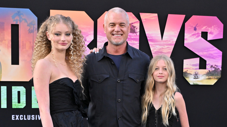 Eric Dane smiles standing between daughters Billie and Georgia