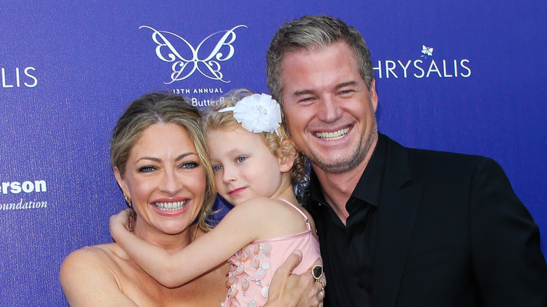 Eric Dane and Rebecca Gayheart posing with their daughter