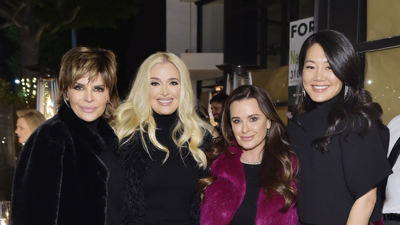 Erika Jayne posing with Lisa Rinna, Crystal Kung Minkoff, and Kyle Richards