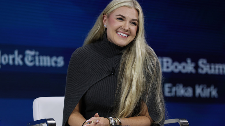 Erika Kirk gray sweater smiling