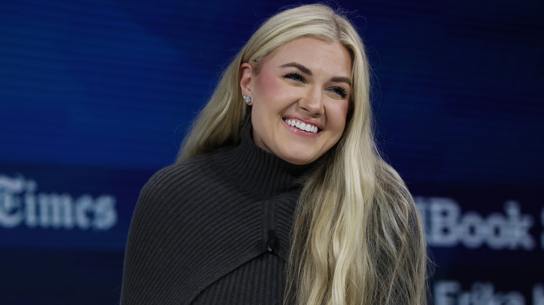 Erika Kirk gray sweater smiling