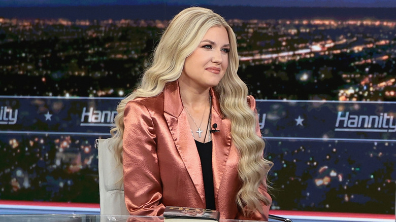 Erika Kirk smiling on the set of 