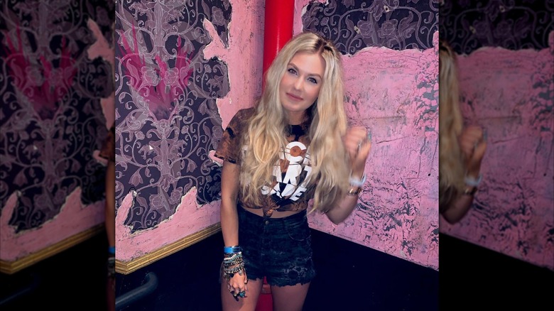 Erika Kirk crop top and short shorts on Instagram