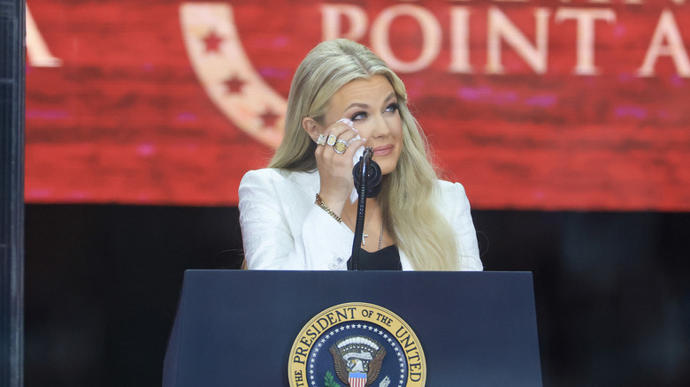 Erika Kirk wiping her tears