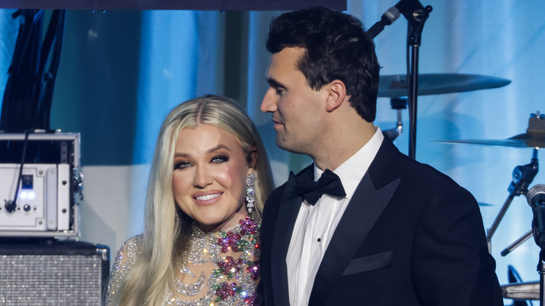 Charlie Kirk and Erika Kirk standing on stage during the Turning Point USA Inaugural-Eve Ball at the Salamander Hotel