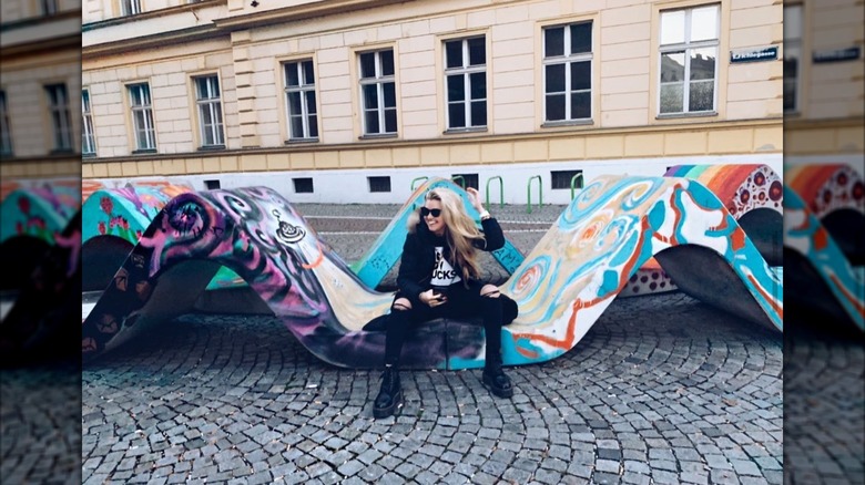 Erika Kirk posing for a photo on a street in Vienna