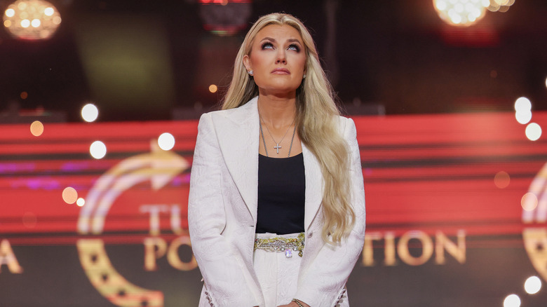 Erika Kirk speaking onstage during the memorial service for her husband, political activist Charlie Kirk at State Farm Stadium