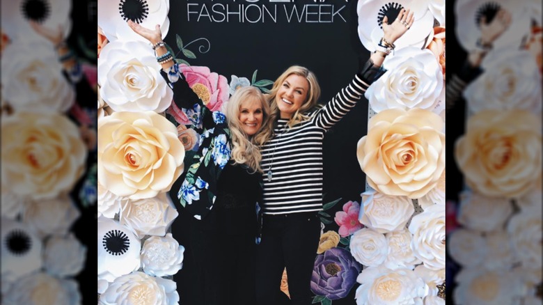 Erika Kirk and Lori Frantzve pose together at Phoenix Fashion Week.