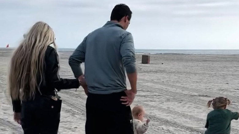 Erika Kirk and Charlie Kirk on a beach