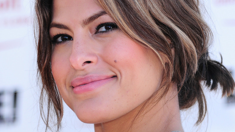 Eva Mendes smiling from side profile