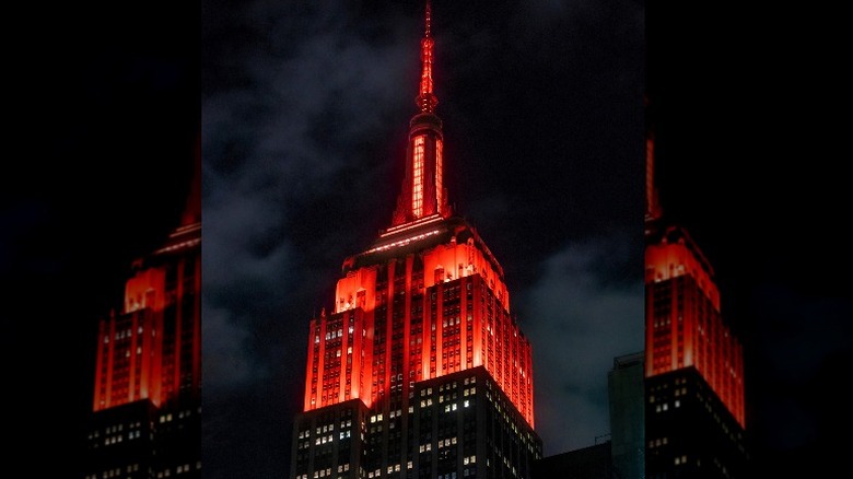 The Empire State Building lights up in red