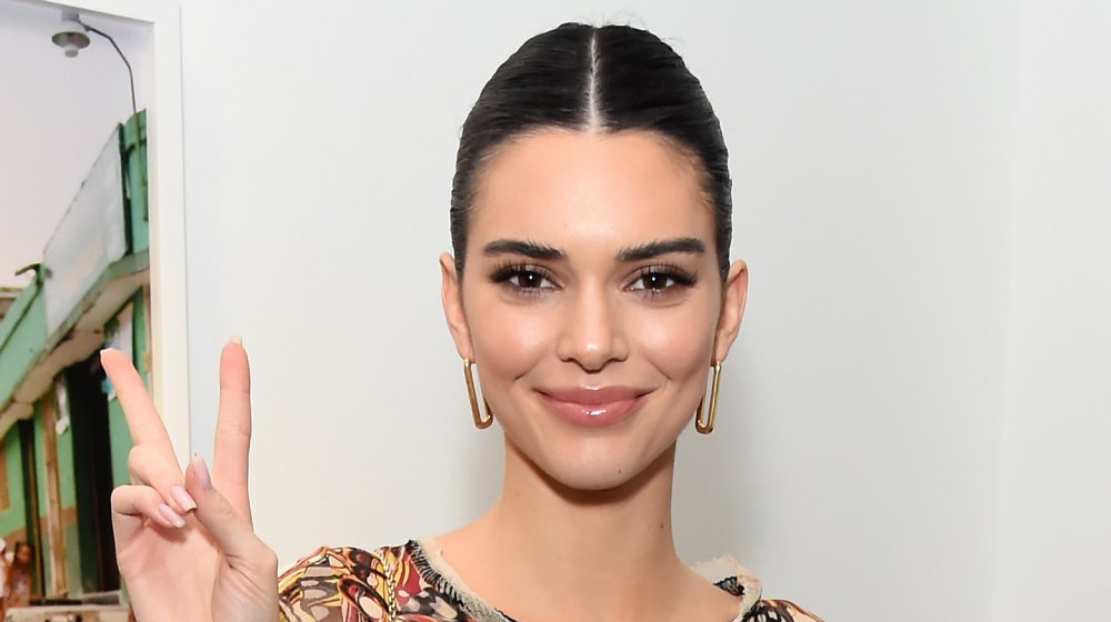Kendall Jenner giving peace sign