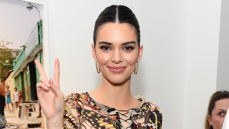 Kendall Jenner giving peace sign
