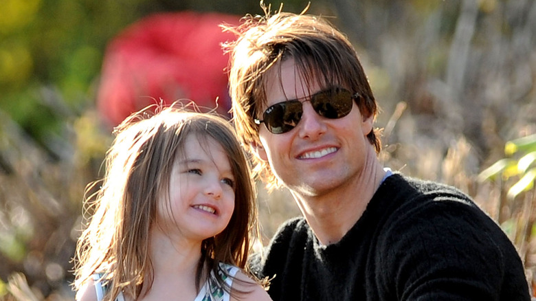 Suri Cruise smiling, Tom Cruise sunglasses