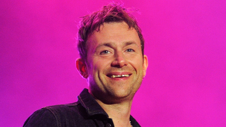 Damon Albarn performing, smiling