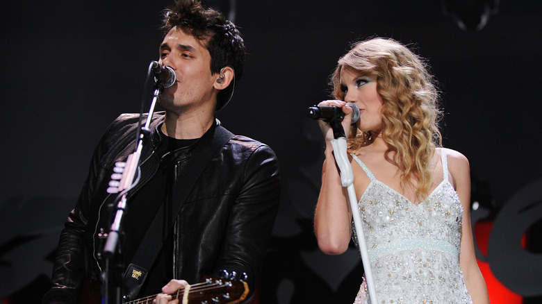 Taylor Swift and John Mayer performing together