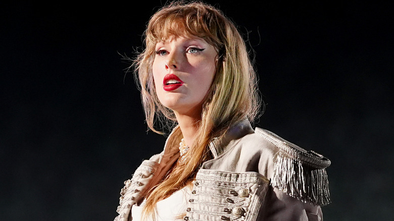 Taylor Swift wearing white military jacket