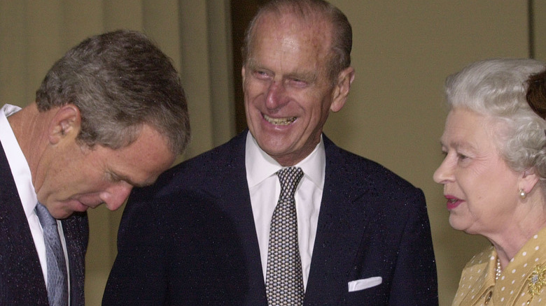 Queen Elizabeth, Prince Phillip, and George W. Bush, all sharing a moment