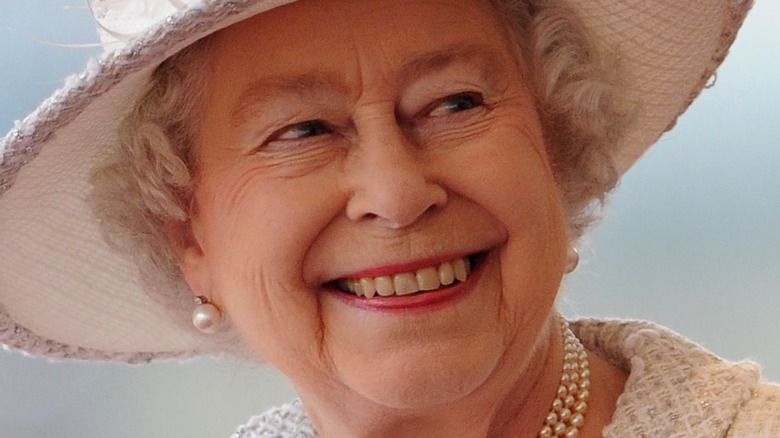 Queen Elizabeth in ivory hat