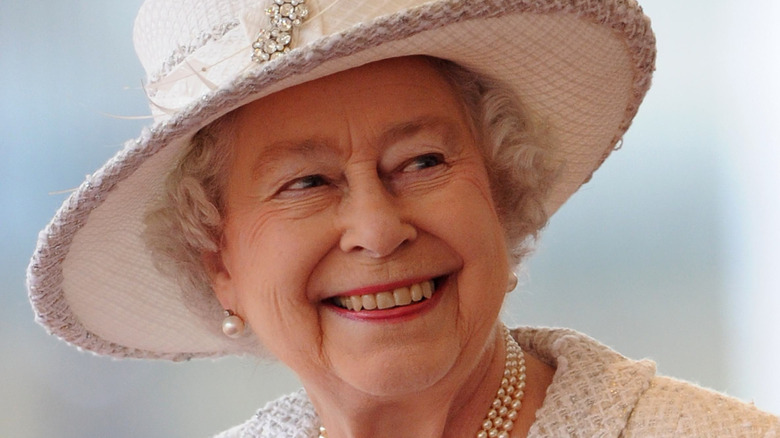 Queen Elizabeth in ivory hat