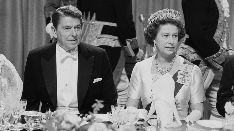 Ronald Reagan and Queen Elizabeth, both seated during dinner