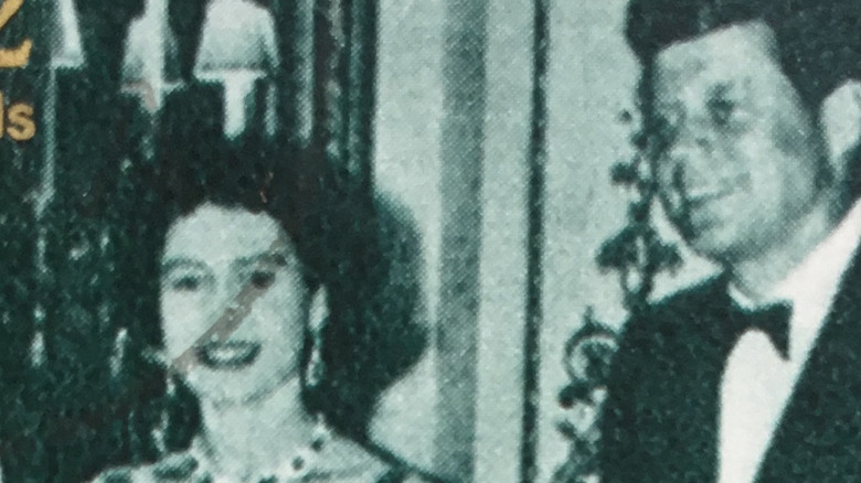 Queen Elizabeth and JFK, both smiling on postage stamp
