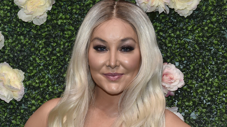 Billie Lee posing on red carpet