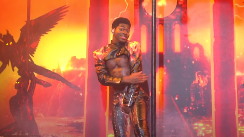 Lil Nas X performs beside pole