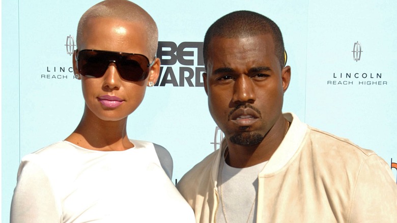 Kanye West posing with Amber Rose