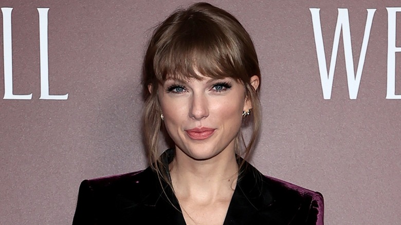 Taylor Swift smiling on red carpet