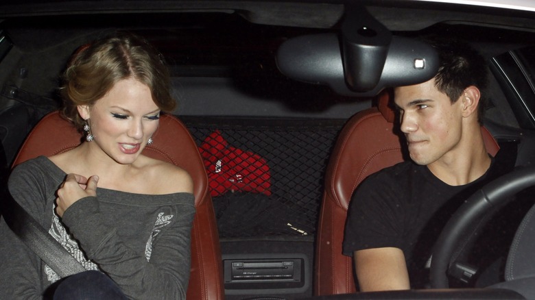 Taylor Swift and Taylor Lautner sitting inside a car