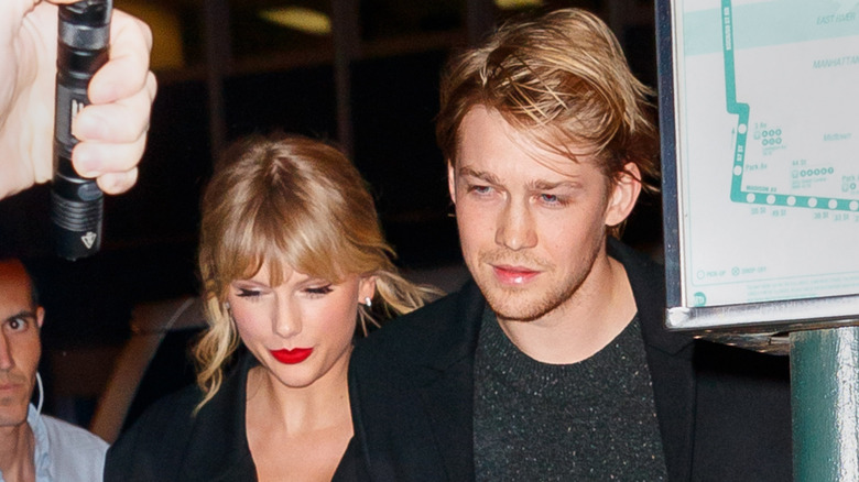Taylor Swift and Joe Alwyn photographed outside at night