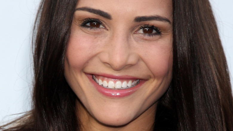 Andi Dorfman smiles at event