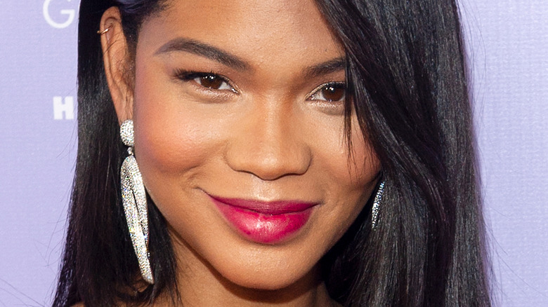 Chanel Iman poses in a red outfit