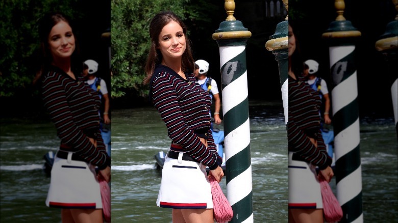 Alba Baptista in striped sweater and skirt