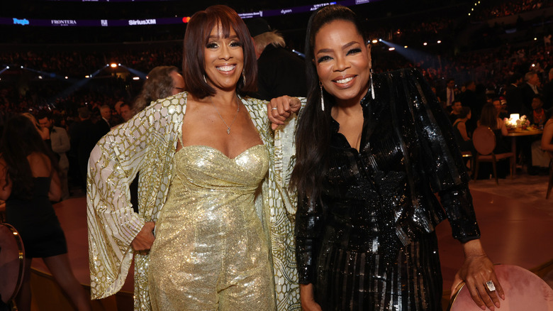 Gayle King and Oprah Winfrey smiling