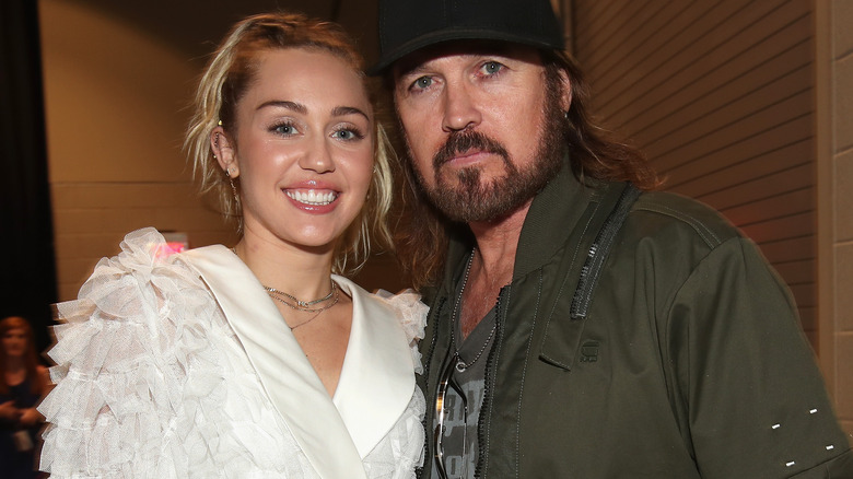 Miley Cyrus Billy Ray Cyrus posing