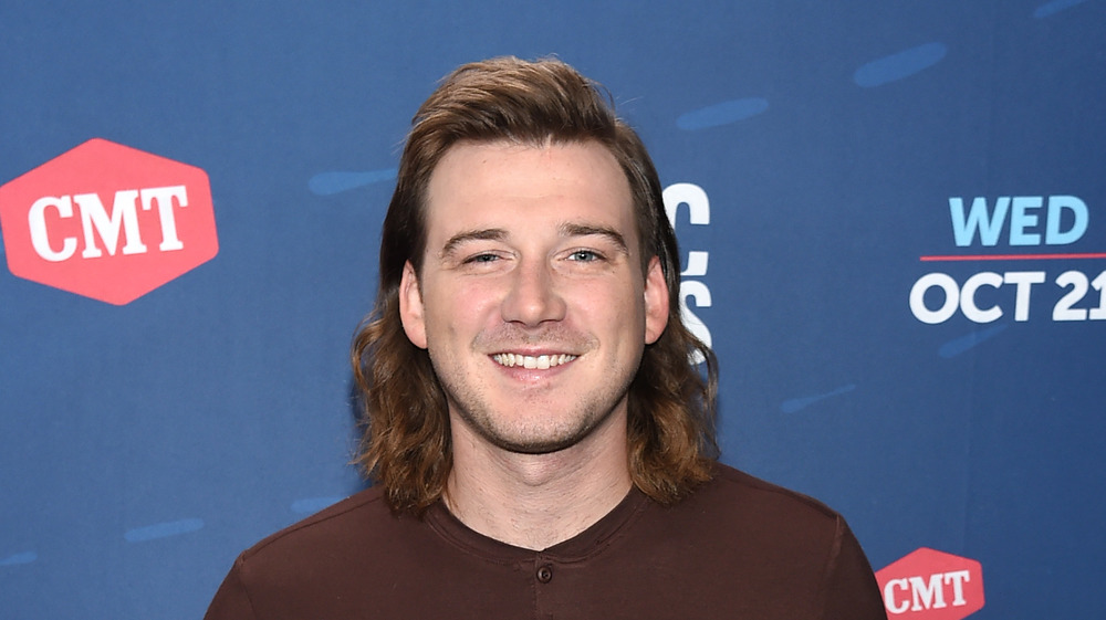 Morgan Wallen smiling on the red carpet