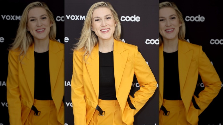 New York Magazine Washington Correspondent Olivia Nuzzi posing in yellow pantsuit